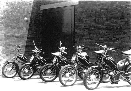 Elswick-Hopper mopeds stand in the yard at Hopper's factory