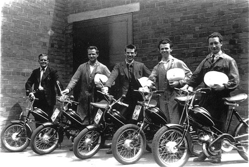 The Elswick-Hopper mopeds and their riders stand in the yard at Hopper's factory