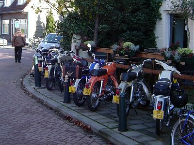 A pavement full of mopeds