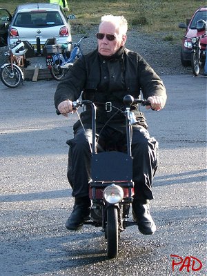 Marcel Mizon rides his Corgi