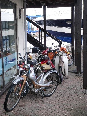Mopeds huddled under the balcony