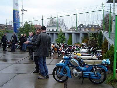 Riders and machines gather as the rain eases up