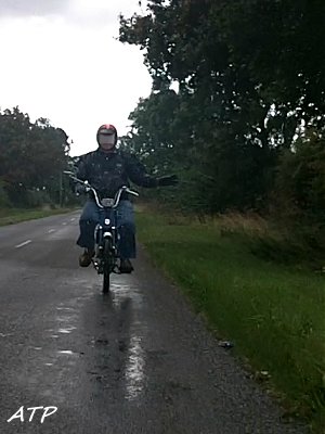 Jim rides through the rain