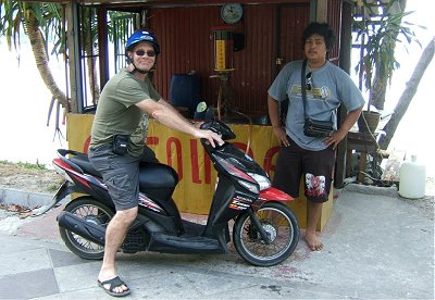 Paul on a Honda Click, braving the Thai roads and stopping at a local filling station