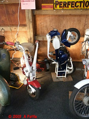 A pair of Moto Graziellas: one in the riding position and one folded and up-ended for storage